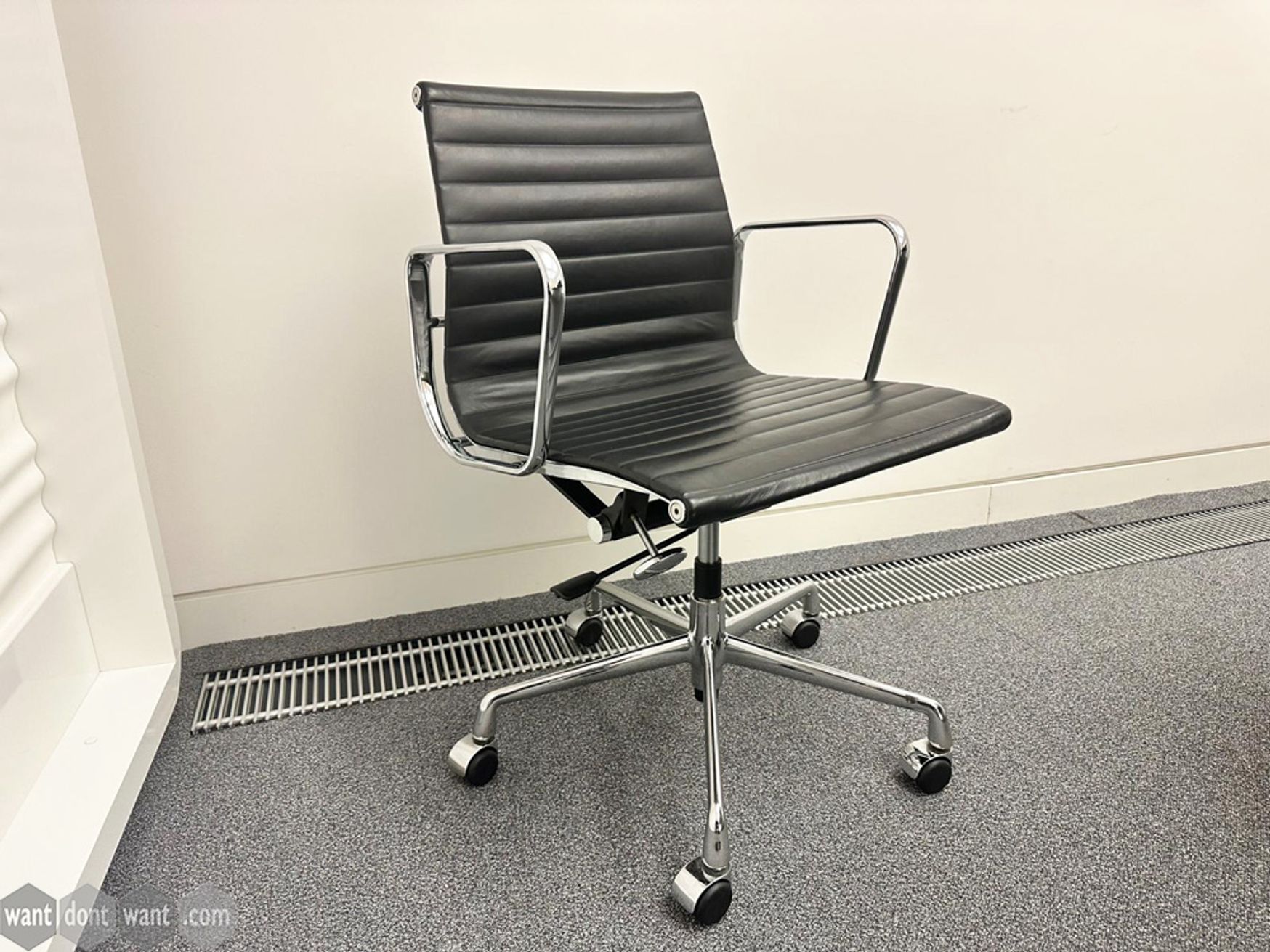 Used Charles Eames copy leather chairs on castors