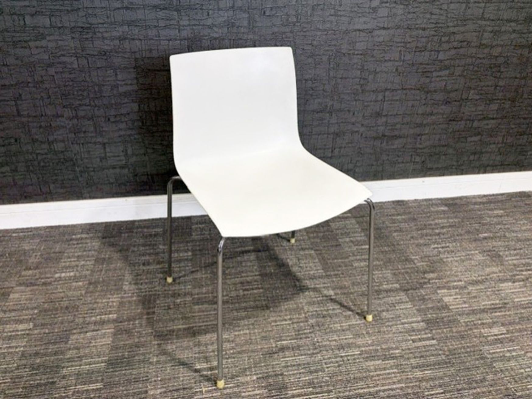Used Arper Catifa white stacking chairs 
