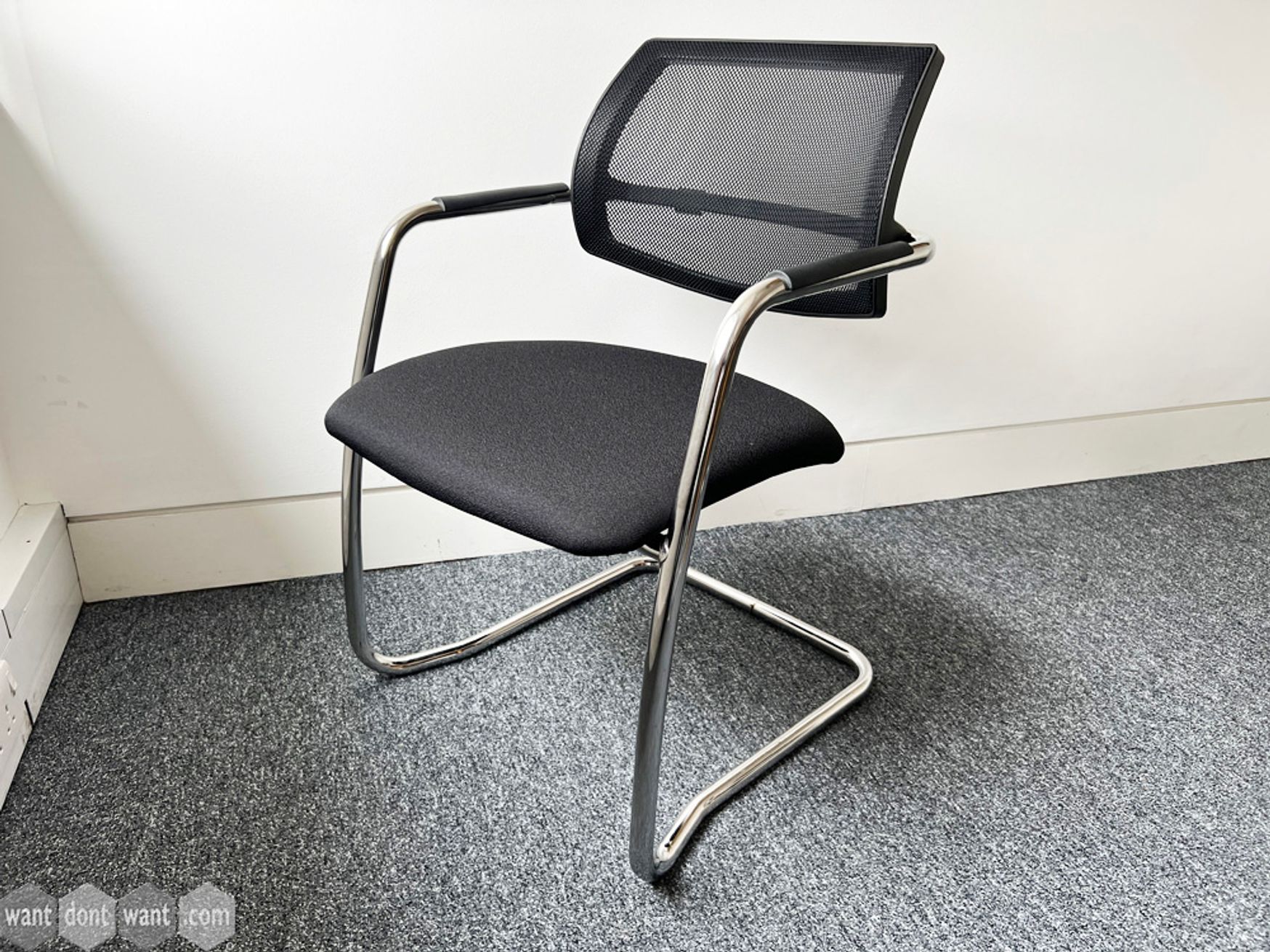Used Moventi 'Dino' chairs with mesh back, black upholstered seat and chrome cantilever frame.