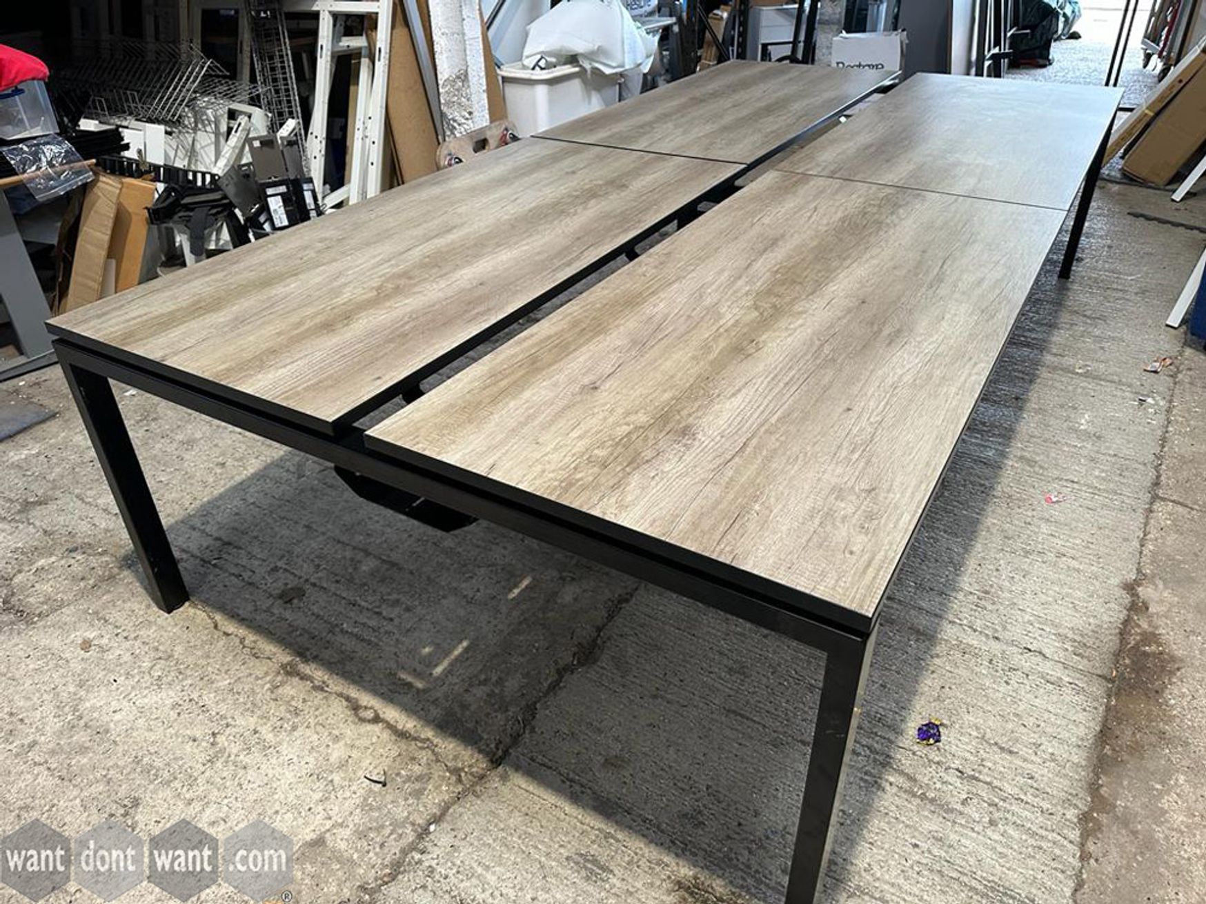 Used 1600mm bench desks with oak tops and black legs