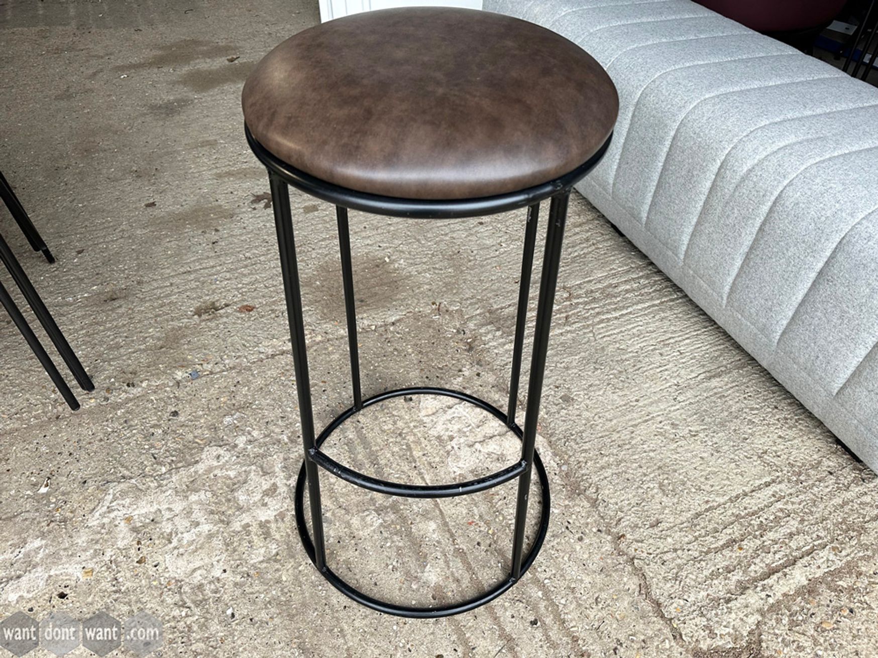 Used bar stool with brown faux leather seat 