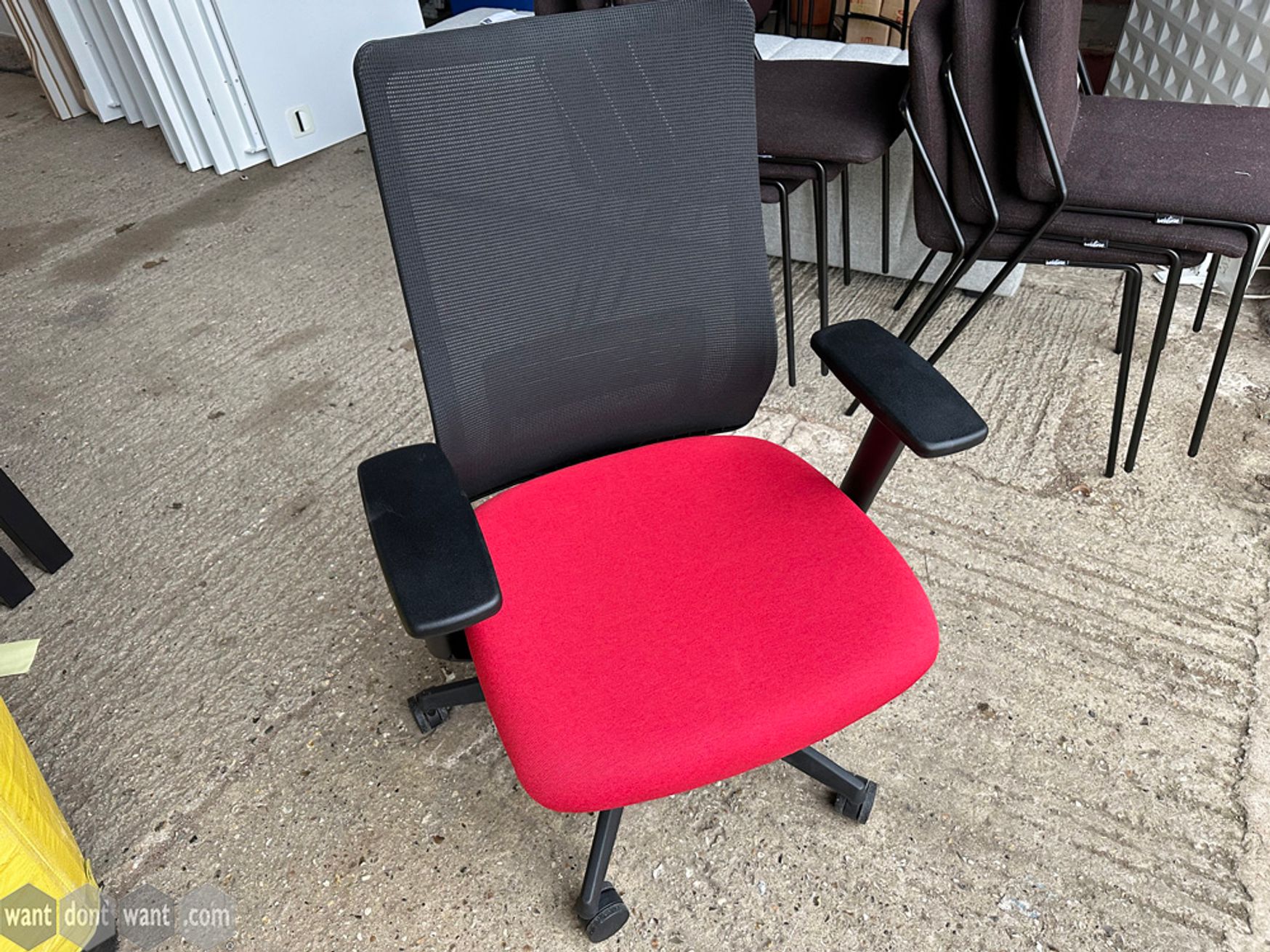 Used Okamura operator chair with red seat 