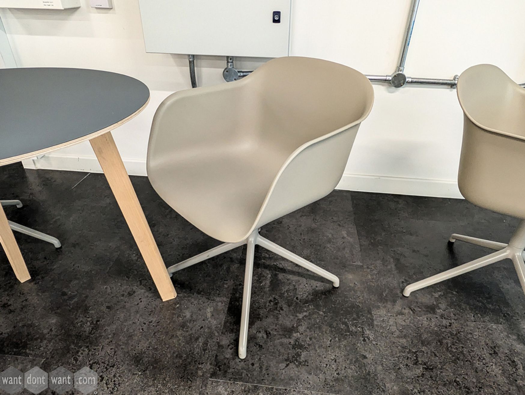 Used Muuto swivel chair on pyramid base