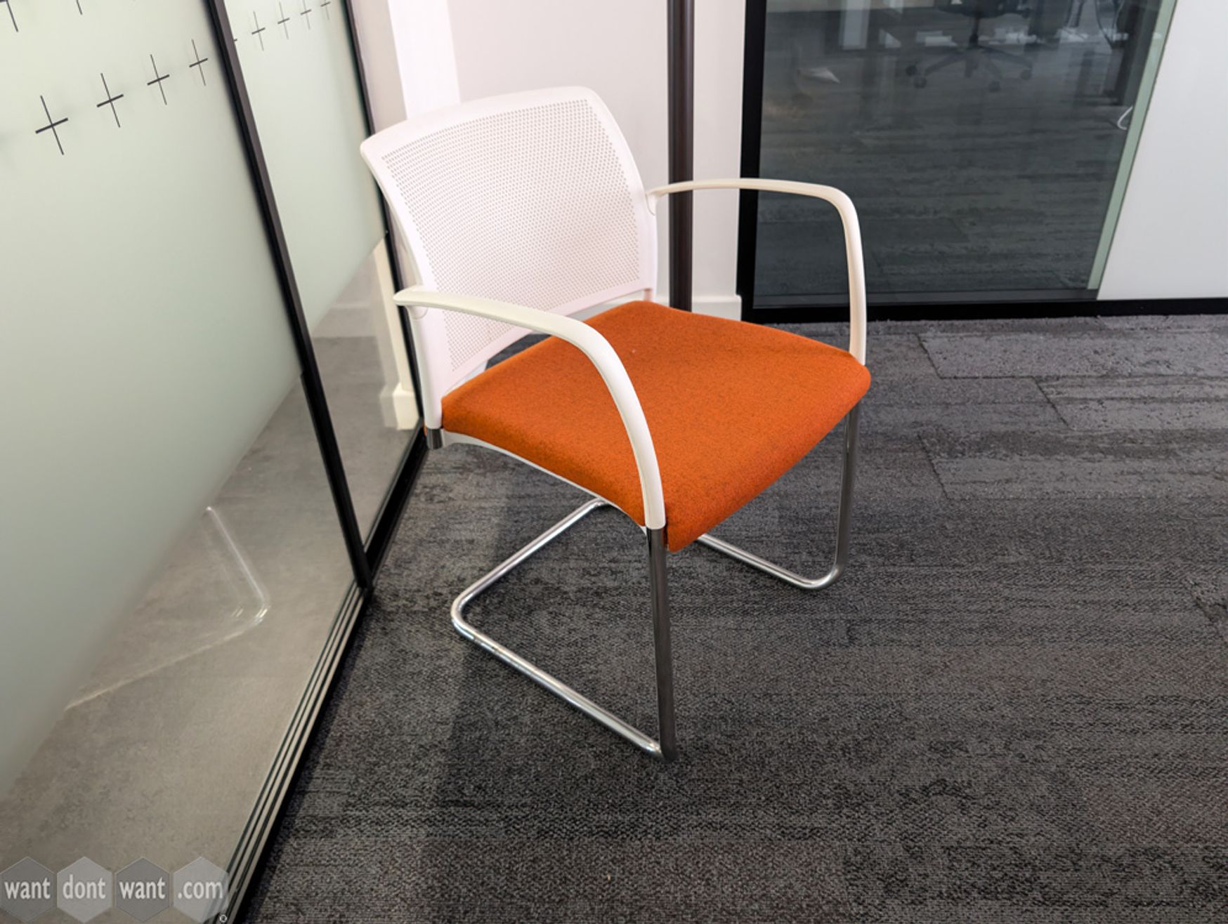 Used Boss Design cantilever chair with orange seat