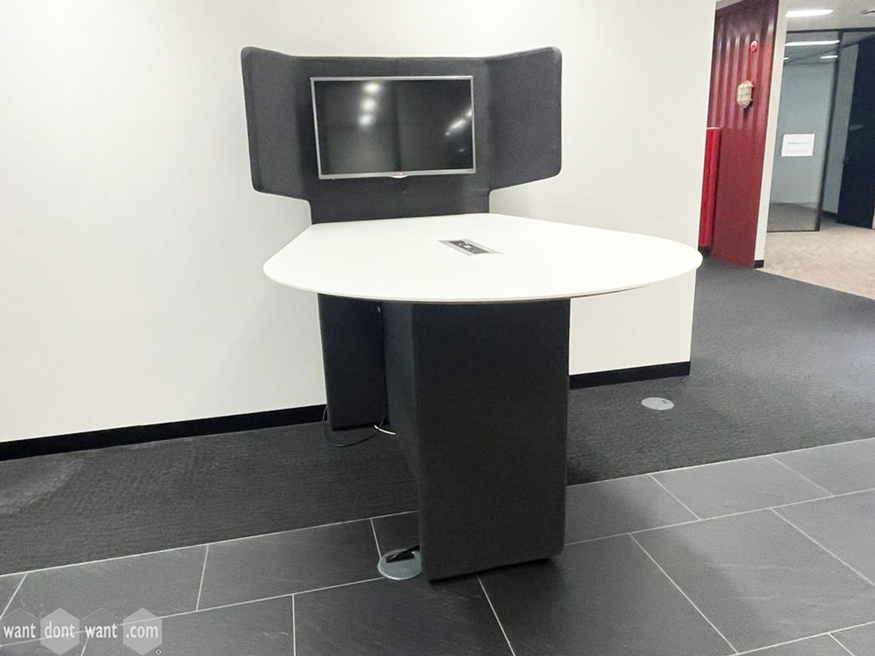 Used fabric Media Wall module with table and monitor.