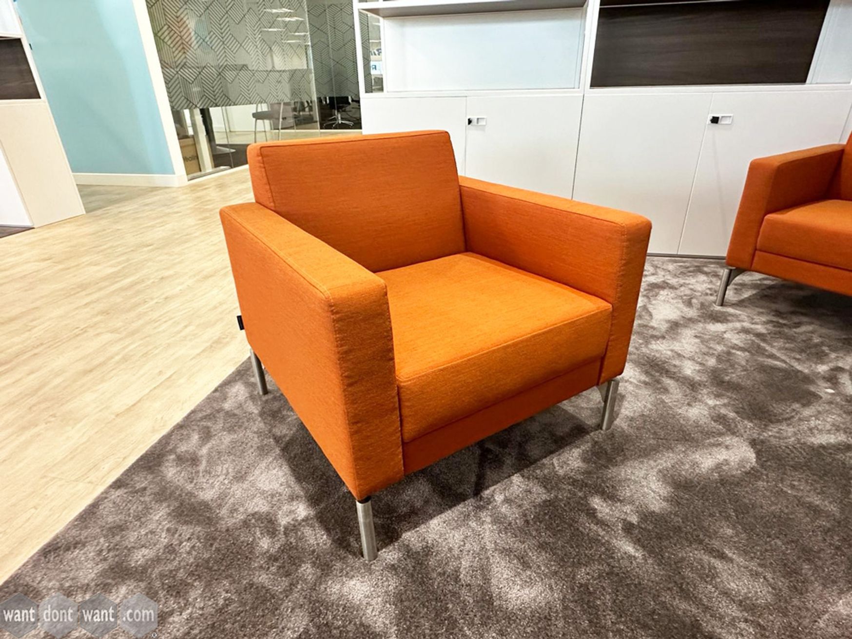 Used Hitch Mylius armchairs upholstered in orange fabric