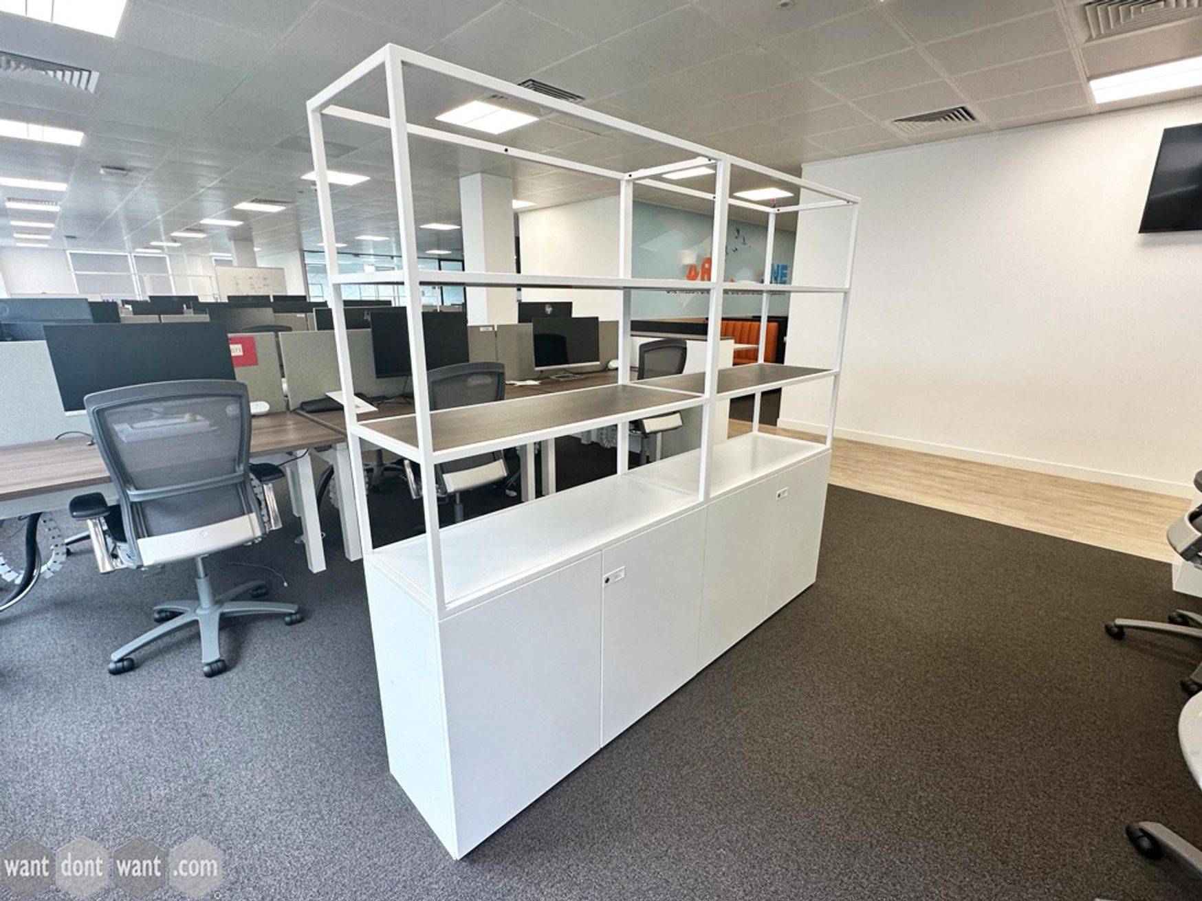 Used Knoll bookcases with double door base units and open backs.