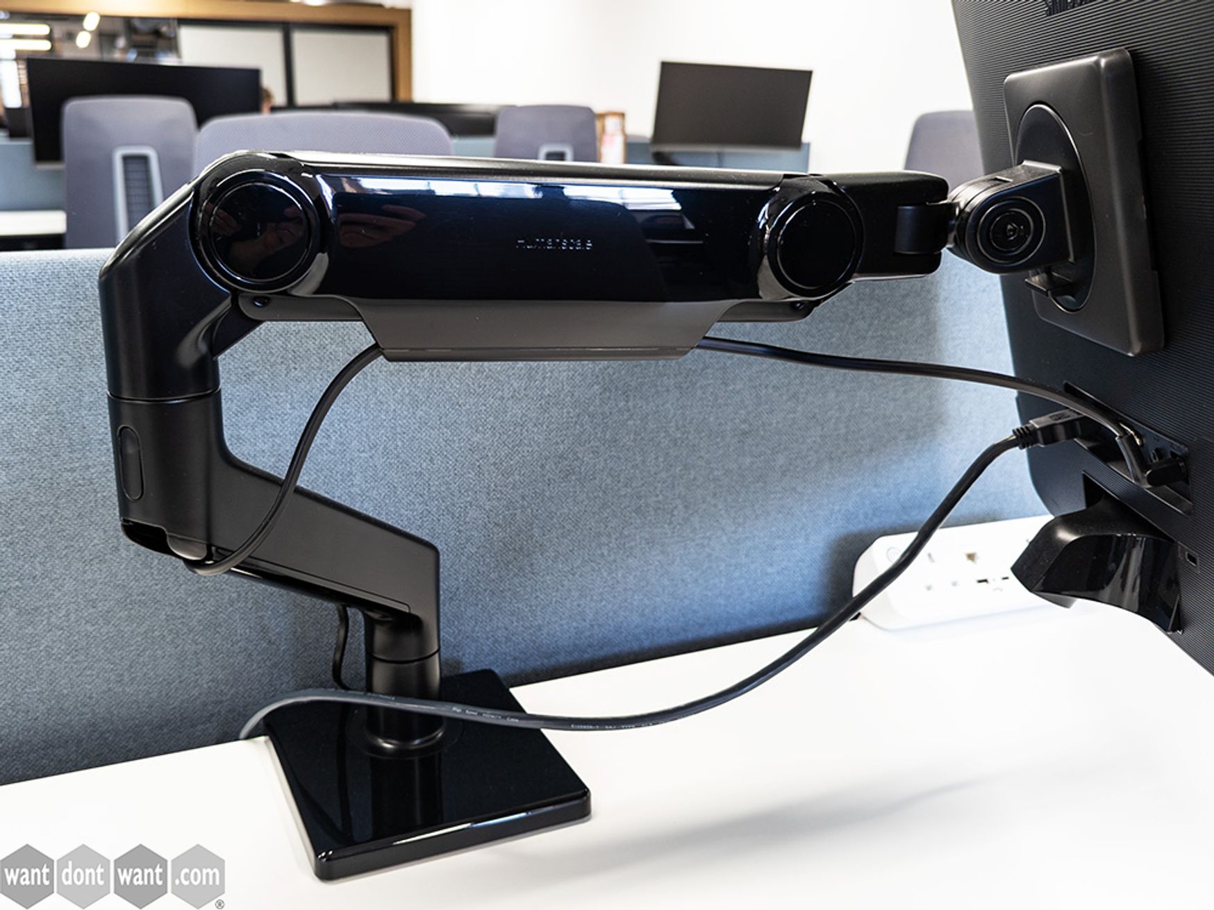 Used black Humanscale M8 single-arm monitors with VESA plate - for slim tops