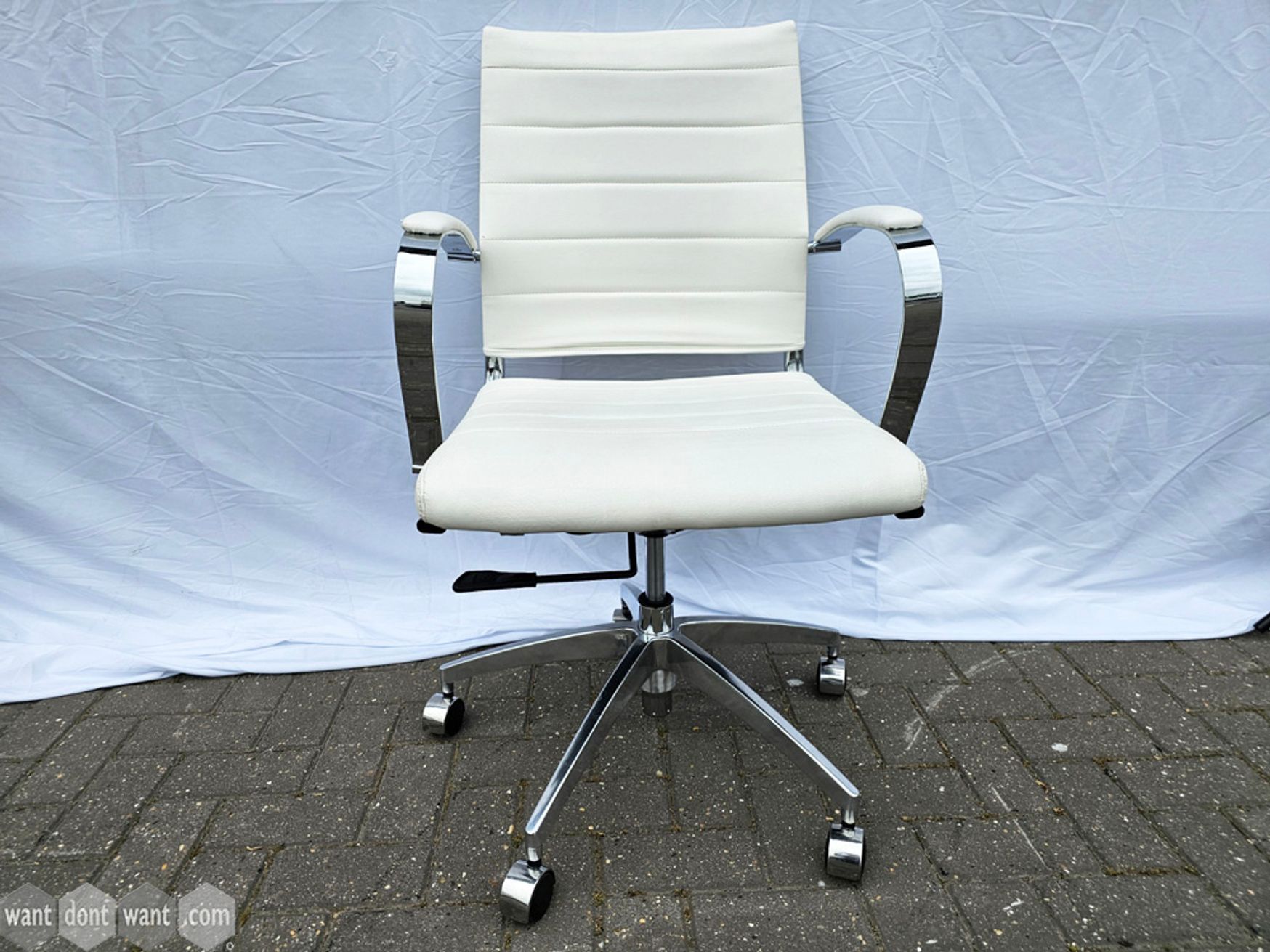 Used swivel meeting chairs in white bonded leather and chrome arms & base.