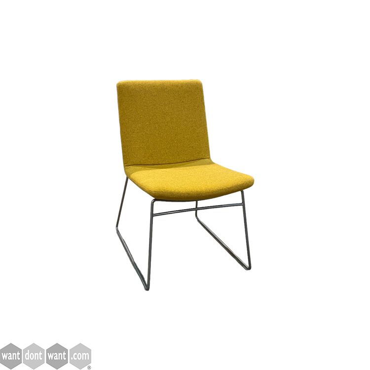 Used meeting chairs upholstered in yellow fabric.