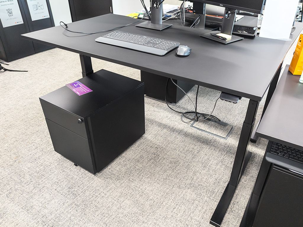 Used 1400mm black sit-stand desk with single cable tray