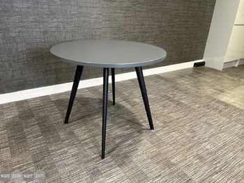 Used 900mm Workstories 'Air' round table with grey top and black legs