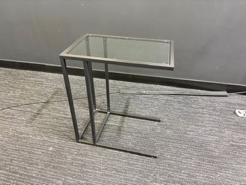 Used side tables in black with glass