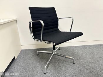 Used Vitra Charles Eames fabric chairs on glides 