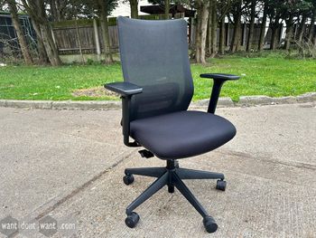 Used Okamura operator chair with black seat