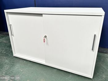 Used white cupboard with sliding doors