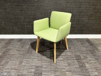 Never used Cor chairs upholstered in light green fabric