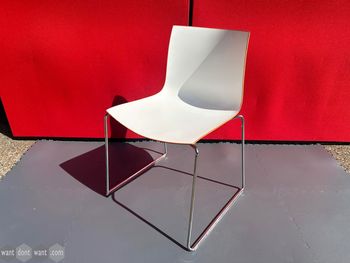 Used Arper Catifa stackable cafe chair - coloured backs