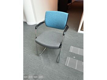 Used Senator stackable meeting chair with blue back and grey seat