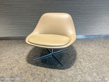 Used Bernhardt cream leather swivel lounge chair