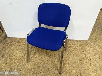 Used ISO stacking chair in blue fabric