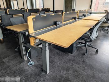 Used 1200mm electric sit-stand back-to-back desks with screens