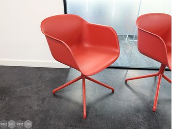 Used Red Muuto swivel chair on pyramid base