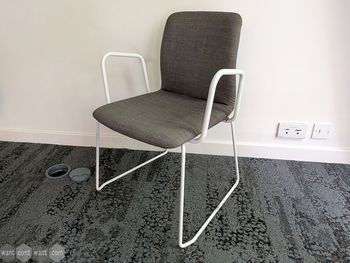 Used Boss Design Arran grey chair with white sled frame and arms