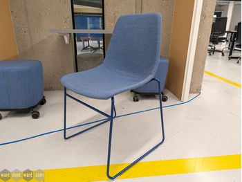 Used Chair with blue upholstery and blue sled base