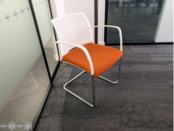 Used Boss Design cantilever chair with orange seat