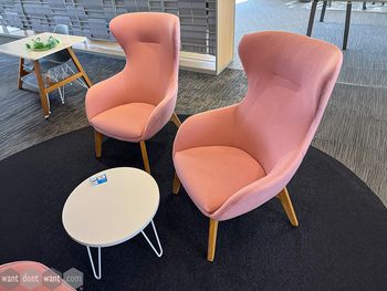Used high-back upholstered chair with wooden legs
