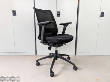 Used Haiken chair with fabric seat and mesh back