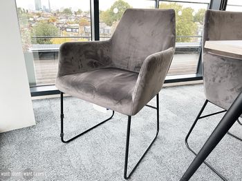 Popular style used meeting chairs upholstered in grey suede-effect fabric with black metal legs.