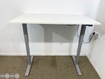 Never used white electric Sit/Stand desks with light grey frames and 2 x cable ports.