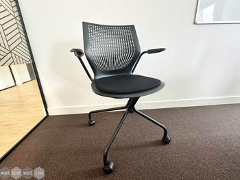 Used Knoll 'MultiGeneration' chair with black seat and hybrid base on castors.