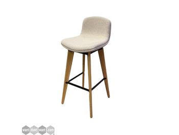 Used barstools with cream upholstered seat and wooden legs.