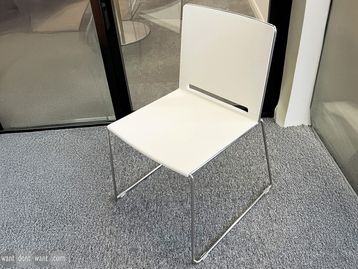 Used white chair on cantilver base