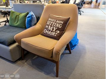 Used armchair with wooden legs