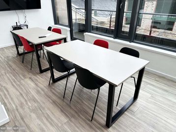 Used 1600mm breakout/meeting tables with Mushroom MFC tops and black loop legs