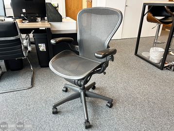 Used Aeron chairs (size B). plastic arms - no lumber support but can be purchased.