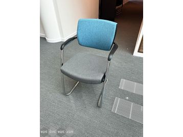 Used Senator stackable meeting chair with blue back and grey seat