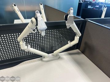 Used CBS flow dual monitor arms