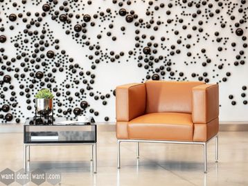 New armchair with high armrests and chrome frame