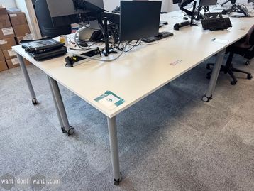 Used 1600mm white single desks on castors