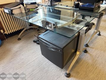 Used 1600mm Frezza glass top desks including pedestals