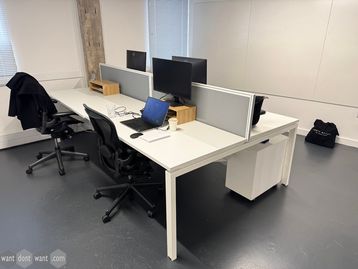 Used 1400mm white bench desks with dividing screens