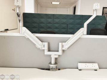 Used Teknion Twin Monitor Arms with Desk Clamp