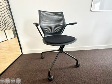 Used Knoll 'MultiGeneration' chair with black seat and hybrid base on castors.