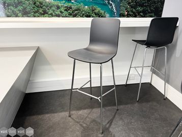 Used Vitra 'Hal' stools with black shell and chrome frame with foot rest.