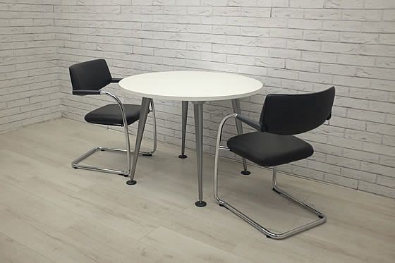 Herman Miller used 'Abak' circular meeting tables with tapered legs in silver finish